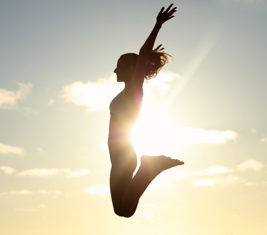 Woman energetically jumping in the air